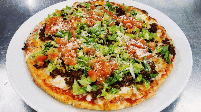 Taco Pizza, Taco meat, pizza cheese, cheddar, lettuce, tomato, jalapeno, taco sauce.