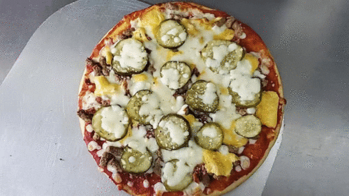 Cheeseburger Pizza with American cheese, pickles, beef