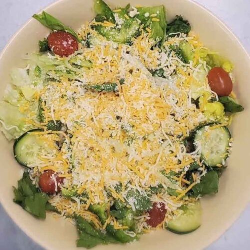 House salad with colby jack cheese, tomato, cucumber, lettuce