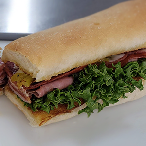 Made with premium meats and provolone cheese, our Italian Sub is filled with pepperoni, ham, salami, lettuce, tomato, onion. on a home made bun