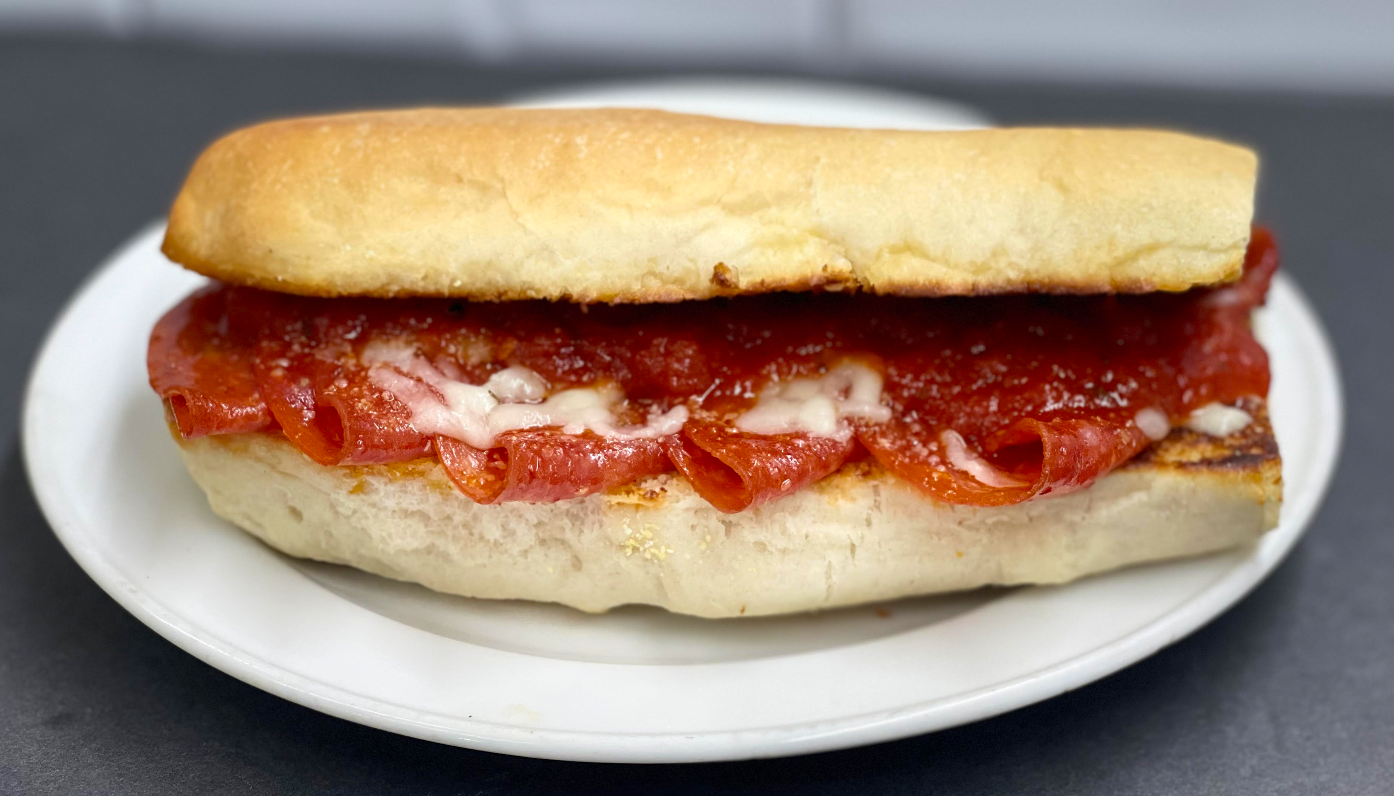 Pepperoni Sub loaded with cheese, delicious pepperoni, marinara on a house made sub roll.