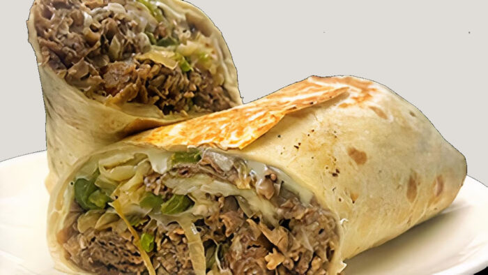Shaved sirloin steak, white American cheese, sauteed onion, and green pepper built on a 14-inch tortilla.