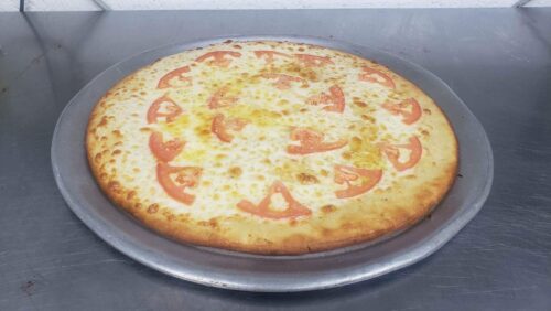 White pizza with garlic sauce, cheese, tomato