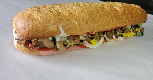 Loaded with pepperoni, sausage, ham, onion and green & banana peppers. Served hot on a fresh house-made sub roll.