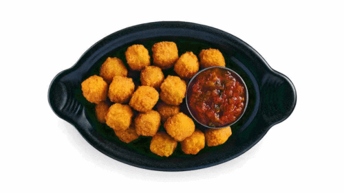 Hot pepper cheese balls with breading on a plate