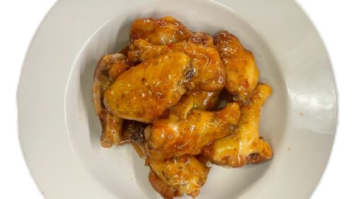 Thai Chili covered wings in a bowl